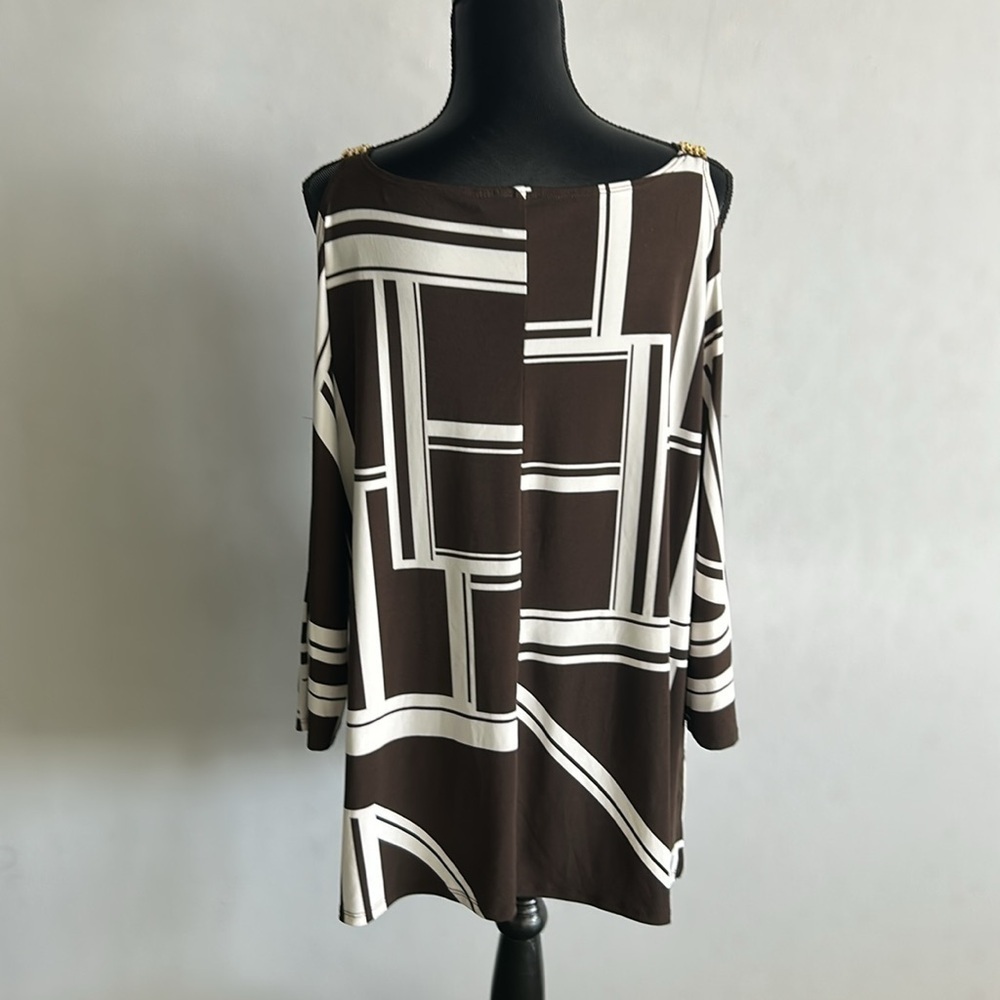 Chico’s cold shoulder tunic. Brown /white. Gold accents. Sz 3(L)
A101 - Picture 6 of 7